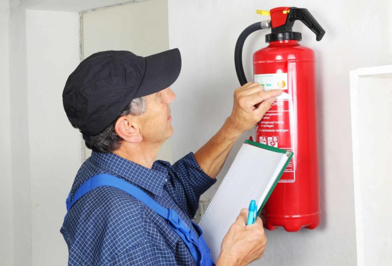 Man inspecting a fire equipment